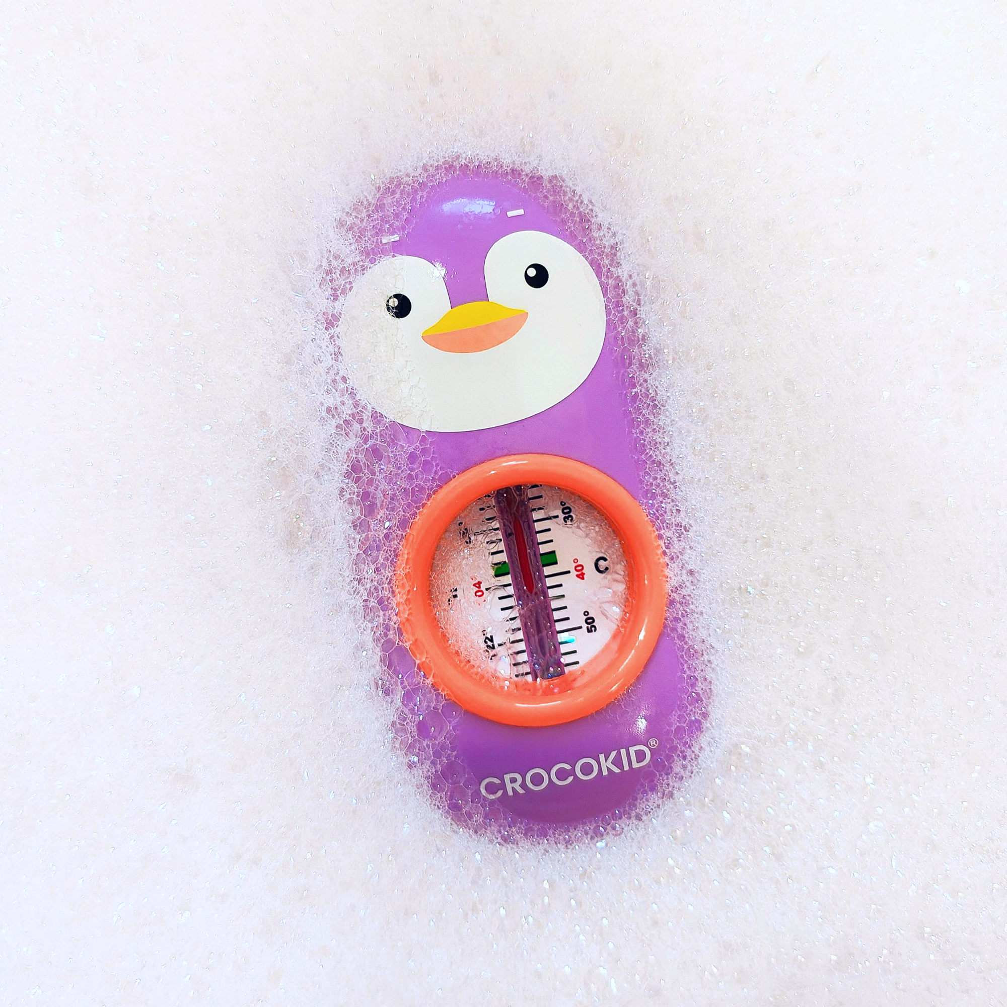 CROCOKID® Thermomètre de bain pingouin violet dans la mousse - jouet ludique